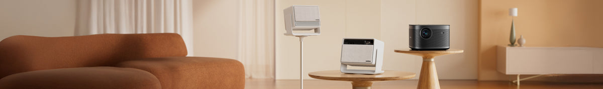 a white speaker on a stand