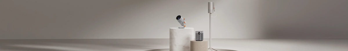 a white camera on a white cylinder